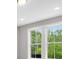 Bright room featuring a bank of windows showing exterior trees and natural light at 577 Red Clay Farm Ln, Suwanee, GA 30024