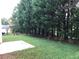 View of back yard with trees at 2143 Gwinn Dr, Norcross, GA 30071