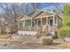 Charming bungalow featuring a welcoming front porch, Craftsman-style details, and a well-maintained lawn at 385 Arthur Sw St, Atlanta, GA 30310