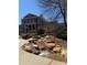 A brick building with stone columns overlooks a rock garden at 475 Letchas Ln, Alpharetta, GA 30009