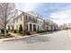 Street view showcasing a row of attractive townhouses with well-maintained landscaping, offering a sense of community at 475 Letchas Ln, Alpharetta, GA 30009