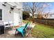 Comfortable backyard with a concrete patio, lawn, and privacy fence and mature trees at 8834 Applegate Ln, Atlanta, GA 30350