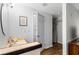 Bright bathroom featuring wood-look flooring, a vanity, and a walk-in closet at 8834 Applegate Ln, Atlanta, GA 30350