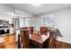 Dining area with stainless steel appliances and wood floors at 8834 Applegate Ln, Atlanta, GA 30350