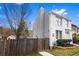 Charming two-story townhome with brick, vinyl siding, a fenced yard, and professionally landscaped yard at 8834 Applegate Ln, Atlanta, GA 30350