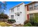 Charming two-story home with a white painted brick facade and well-maintained landscaping at 8834 Applegate Ln, Atlanta, GA 30350