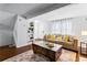 Bright living room featuring hardwood floors, staircase, and neutral decor at 8834 Applegate Ln, Atlanta, GA 30350