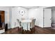 Basement dining room with wood-look flooring and a large clock at 8834 Applegate Ln, Atlanta, GA 30350