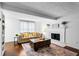 Bright living room featuring hardwood floors, fireplace, and neutral decor at 8834 Applegate Ln, Atlanta, GA 30350