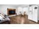 Basement living room with wood-look flooring and a large refrigerator at 8834 Applegate Ln, Atlanta, GA 30350