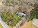 Aerial view of the home, garage and expansive wooded lot at 11637 Brown Bridge Rd, Covington, GA 30016