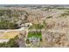 Wide aerial shot showcasing a large property with manicured lawns and a wooded perimeter at 11637 Brown Bridge Rd, Covington, GA 30016