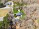 Aerial view of a beautiful home, pool, and sprawling property, surrounded by lush trees and greenery at 11637 Brown Bridge Rd, Covington, GA 30016