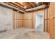 Unfinished basement with exposed wooden framing and concrete floor at 11637 Brown Bridge Rd, Covington, GA 30016