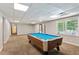 Finished basement featuring a pool table and access to the backyard at 11637 Brown Bridge Rd, Covington, GA 30016