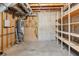 Unfinished basement space with exposed wooden framing and a hot water tank at 11637 Brown Bridge Rd, Covington, GA 30016