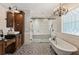 Bathroom featuring standalone tub and walk-in shower at 11637 Brown Bridge Rd, Covington, GA 30016