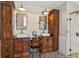 Stylish bathroom featuring double vanities, unique tile flooring, and a glass-enclosed shower at 11637 Brown Bridge Rd, Covington, GA 30016