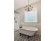 Bathroom with freestanding tub and a view at 11637 Brown Bridge Rd, Covington, GA 30016