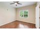 Cozy bedroom with wood-look floors, window, and neutral color palette at 11637 Brown Bridge Rd, Covington, GA 30016