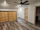 Bedroom with built in storage and wood look flooring at 11637 Brown Bridge Rd, Covington, GA 30016