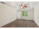 Bright bedroom featuring a ceiling fan and a window with natural light at 11637 Brown Bridge Rd, Covington, GA 30016