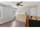 Bedroom with wood-look floors, natural light, and some furnishings at 11637 Brown Bridge Rd, Covington, GA 30016