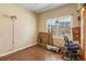 Bedroom with natural light from window; the space is cluttered with boxes and bags at 11637 Brown Bridge Rd, Covington, GA 30016