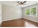 Bedroom featuring a ceiling fan, natural light, and hardwood flooring at 11637 Brown Bridge Rd, Covington, GA 30016