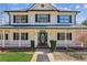 Inviting front porch with decorative columns, a charming 'Welcome' sign, and landscaped greenery at 11637 Brown Bridge Rd, Covington, GA 30016