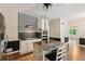 Modern kitchen features stainless steel appliances, center island with seating, and decorative backsplash at 11637 Brown Bridge Rd, Covington, GA 30016
