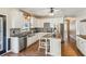 Bright kitchen with white cabinetry, stainless steel appliances and dark countertops at 11637 Brown Bridge Rd, Covington, GA 30016