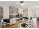 This kitchen features white cabinetry, wood floors and a large center island at 11637 Brown Bridge Rd, Covington, GA 30016