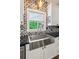 Farmhouse style kitchen with stainless steel sink and stylish tile backsplash at 11637 Brown Bridge Rd, Covington, GA 30016