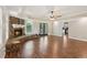 Living room features a stone fireplace, wood-look floors, and French doors leading to the outdoors at 11637 Brown Bridge Rd, Covington, GA 30016