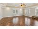 Large main bedroom with wood floors, tray ceiling, and lots of natural light at 11637 Brown Bridge Rd, Covington, GA 30016