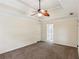 Main bedroom with a neutral color palette and a glimpse of the en suite at 11637 Brown Bridge Rd, Covington, GA 30016