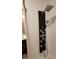 Modern shower panel with multiple jets and a rainfall shower head, complemented by white subway tile at 11637 Brown Bridge Rd, Covington, GA 30016