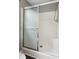 Clean shower with sliding glass doors and a built in seat at 11637 Brown Bridge Rd, Covington, GA 30016