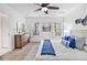 Bright bedroom featuring two windows, neutral walls, modern furniture, and carpeted floors at 1350 Bluefield Sw Dr, Atlanta, GA 30310