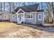 Charming home with a freshly painted exterior, a welcoming front porch, and well-maintained landscaping at 1350 Bluefield Sw Dr, Atlanta, GA 30310