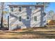 Rear view of the home showcasing the siding, windows, and backyard space at 1350 Bluefield Sw Dr, Atlanta, GA 30310