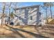 Back of the home showcasing the siding, windows, and backyard space at 1350 Bluefield Sw Dr, Atlanta, GA 30310