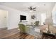 Cozy living room with hardwood floors, comfortable seating, and ample natural light at 1350 Bluefield Sw Dr, Atlanta, GA 30310