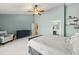 Bedroom featuring vaulted ceiling, neutral paint, carpet and fan with view to ensuite at 2955 Victoria Park Dr, Buford, GA 30519