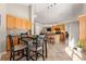 Bright eat-in kitchen area with wood cabinets and an island with barstool seating at 2955 Victoria Park Dr, Buford, GA 30519