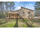 Backyard view featuring a deck with an overhead structure and grill at 425 Ridgemont Dr, Lawrenceville, GA 30046