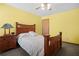 Bedroom featuring a bed with a wooden headboard and a wooden dresser at 425 Ridgemont Dr, Lawrenceville, GA 30046