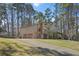 Two-story home featuring an attached two-car garage, a quaint porch, and a long driveway at 425 Ridgemont Dr, Lawrenceville, GA 30046