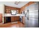 Kitchen featuring oak cabinets, stainless steel appliances, and hardwood floors at 425 Ridgemont Dr, Lawrenceville, GA 30046